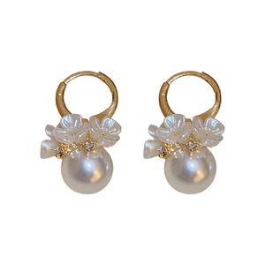 Elegant gold flower hoop earrings with white pearls and sparkling rhinestone petals