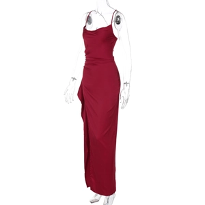 Detail view of wine red satin evening dress showing side slit and waist pleats