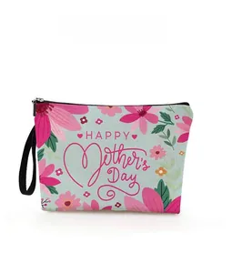 Detail view of blue Mother's Day makeup bag with pink flowers and hanging wrist strap