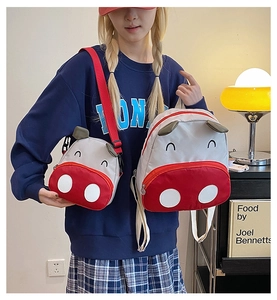 Matching set of cartoon cow backpack and crossbody bag for toddlers with red nose detail