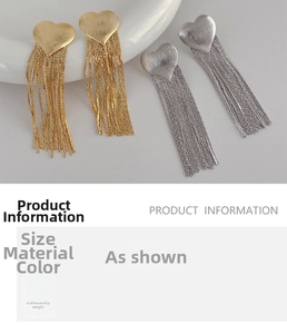 Detailed view of long heart fringe earrings in gold and silver luxury metal finishes