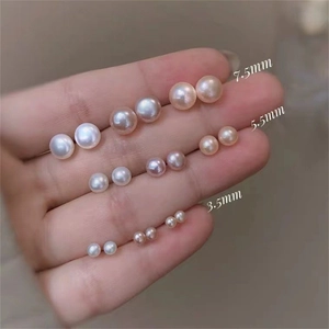 Three sizes of 925 silver natural freshwater pearl earrings in white pink and purple
