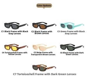 Multiple vintage oval narrow frame sunglasses in various colors with gold metal hinges