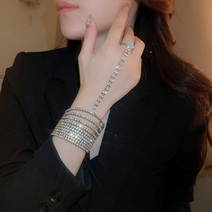 Silver multi-layer rhinestone ring bracelet set on a model with elegant diamond accents
