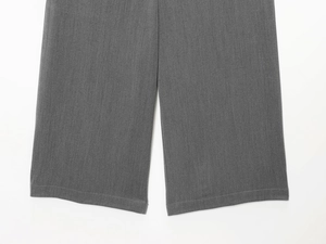 Detailed macro view of dark grey woven fabric texture with durable double-stitched hem