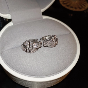 Detail of silver snake bone ear cuff with cubic zirconia in a jewelry gift box