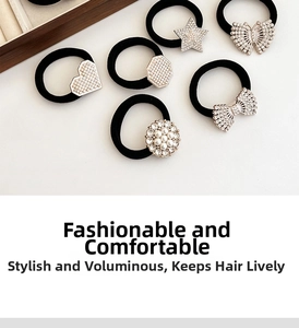 Macro detail of various black elastic hair ties with rhinestone heart and bow charms