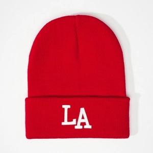Classic red knitted beanie with white LA logo embroidery for a trendy street style look