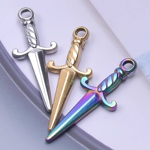 Three stainless steel sword pendants in gold, silver, and iridescent 18k plated finishes