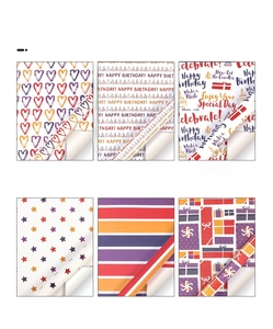 Detailed view of colorful wrapping paper with hearts, stars and birthday greeting designs