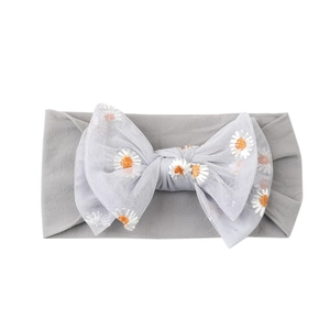 Elastic baby headband in grey with large tulle bow featuring daisy flower embroidery