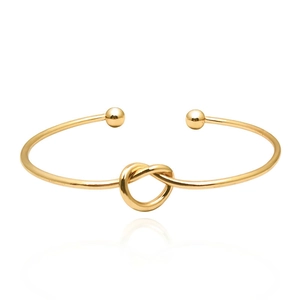 Polished gold knot open bangle bracelet with metallic sphere ends and mirror finish