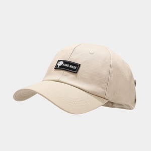 Beige hip-hop baseball cap with aviator sunglasses and 'Hand Made' patch on cotton fabric
