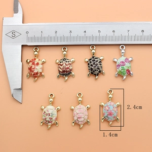 Macro shot of colorful turtle alloy charms with precise measurements of 2.4cm by 1.4cm
