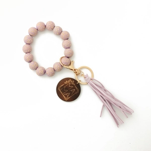 Purple leopard print beaded keychain bracelet with MAMA wooden disc and suede tassel