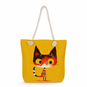 Detail of a yellow canvas tote bag featuring thick cotton rope handles and a cat illustration