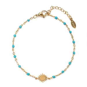 Detail of gold stainless steel bracelet with teal beads and sunburst charm
