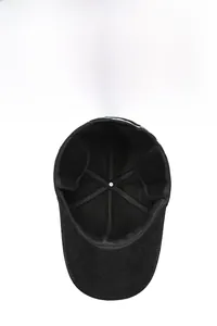 Detail view of the soft fleece lining and foldable earflaps on a black winter baseball cap