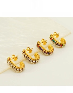 Detail view of U-shaped gold plated titanium earrings with double row inlaid rhinestones