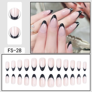 Almond French tip press-on nails in nude and black with 24-piece full set display
