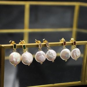 Elegant baroque pearl earrings with emerald gemstones and gold-plated silver hooks