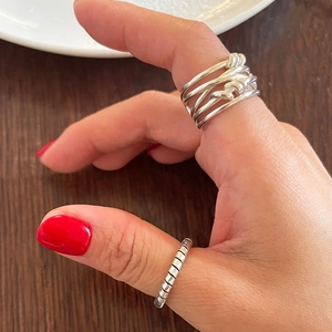 Minimalist 925 sterling silver woven knotted ring and spiral band on hand view