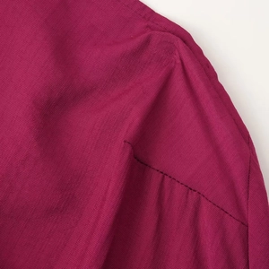 Elegant rose red halter maxi dress with premium fabric texture and shoulder stitching detail