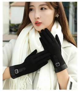 Detail of black suede winter gloves for women with buckle strap and touch screen tip