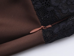 Detail of satin fabric with black lace mesh and seamless zipper on a winter dress