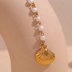 18K gold plated shell pendant necklace with white pearls on elegant display