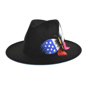 Detail of artistic butterfly print with American flag stars and stripes on black fedora