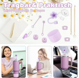 Detail of purple Stanley cup accessories including flower straw covers and silicone boot