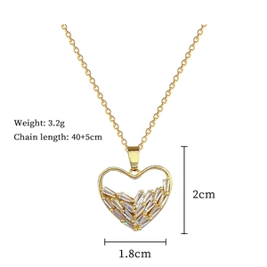 Macro detail of gold heart necklace with zircon inlay and product weight dimensions