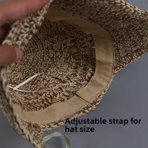 Detail of handmade straw hat inner lining featuring adjustable drawstring for custom fit