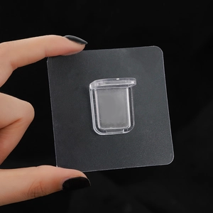 Macro shot of transparent adhesive wall hook for shelf mounting with high clarity