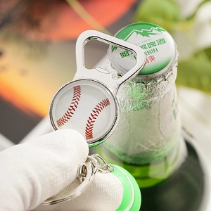 Detail of metal baseball bottle opener keychain showing the round glass dome and ring