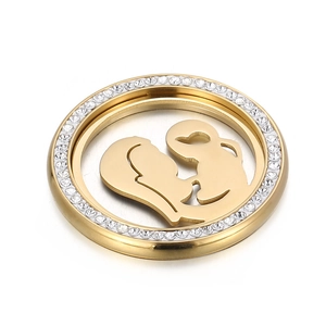 Detailed view of a gold mother and child silhouette pendant with sparkling rhinestones