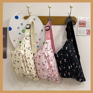 Three colors of cute sausage dog canvas waist bags hanging on a creative hook