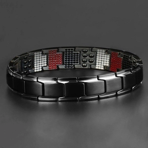 Detail of black magnetic therapy bracelet featuring tri-color energy stones on inner links