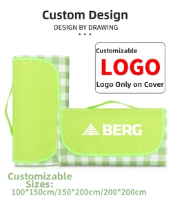 Waterproof Oxford picnic mat in green plaid with portable carry handle and size options