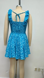 Detail of floral backless dress with self-tie bow and smocked elastic bodice detail