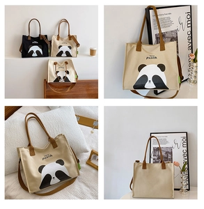 Detail view of large canvas tote bag showing cute panda prints and dual shoulder straps