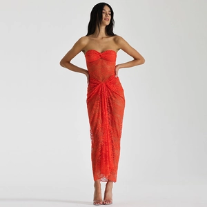 Detail of red lace maxi dress featuring mesh splicing, cutout design, and pleated texture