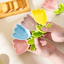 Close-up of colorful tulip-shaped ceramic spoons in yellow, pink, blue, and purple hues