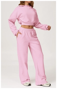 Pink two-piece tracksuit set with hooded crop sweatshirt and wide-leg casual pants