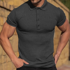 Close-up of men's dark grey ribbed polo shirt showing vertical texture and three buttons