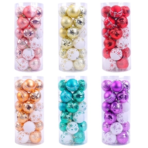 Assorted painted Christmas ball sets in transparent cylinders for holiday tree decoration