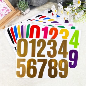 Detailed view of colorful 4-inch self-adhesive number stickers in a fan arrangement