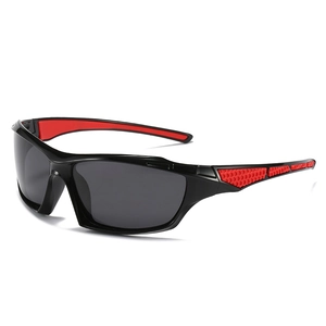 Detail of square frame sports sunglasses showing red non-slip rubber temples and black frame
