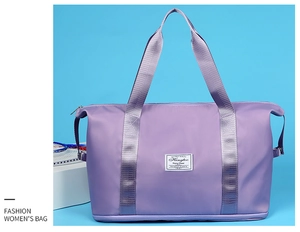 Detail of purple travel bag featuring water-resistant fabric and bottom shoe compartment